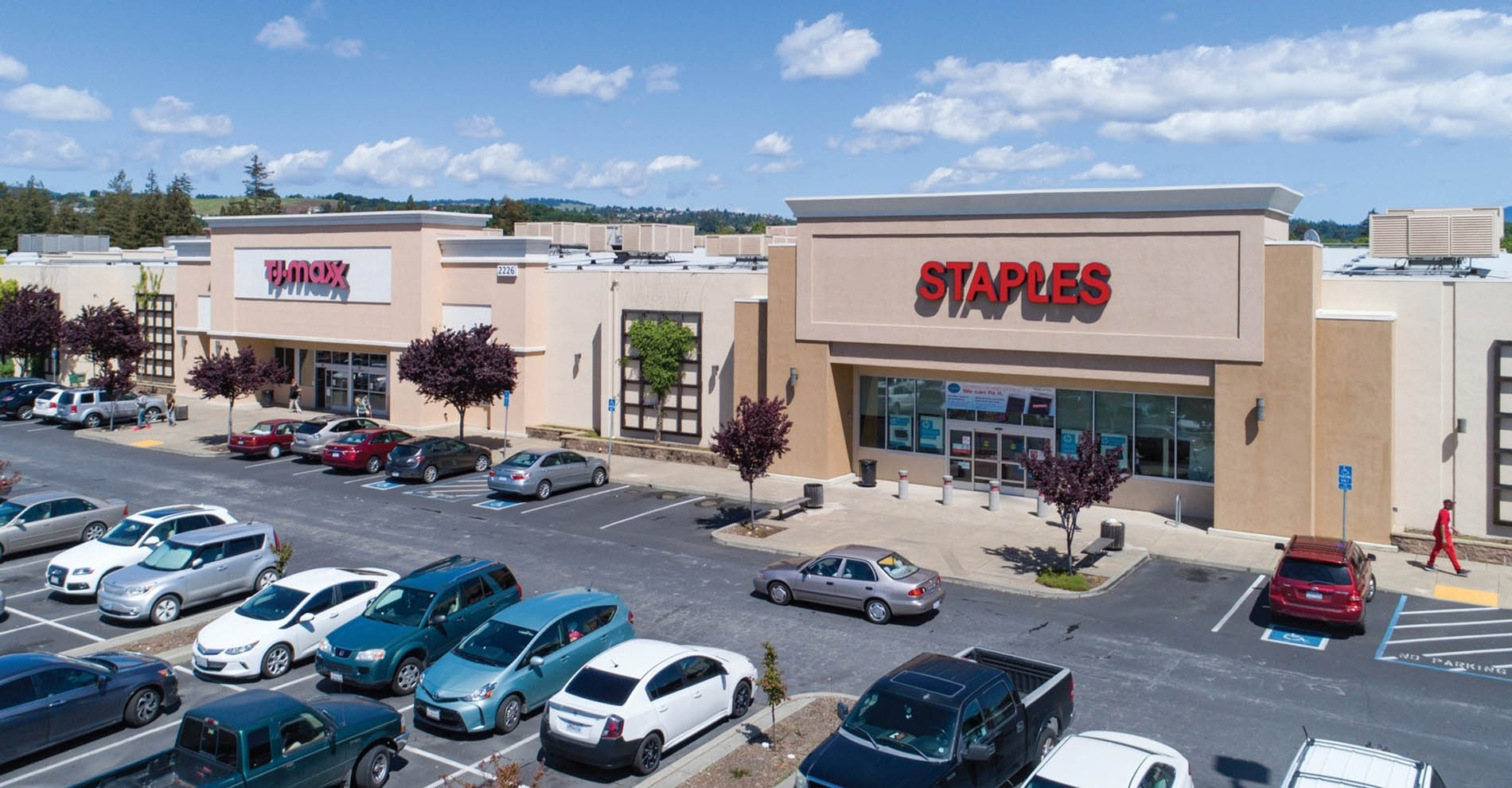 Exterior view of shopping center with staples store